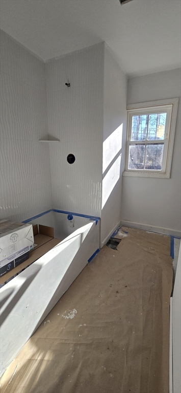 109 Mendon Road Sutton, MA 01590 - Photo 11 of 17 a view of an empty room with windows