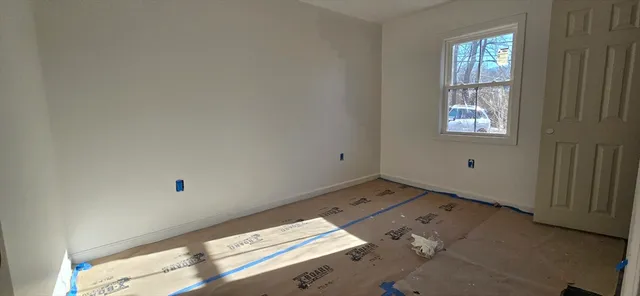 an empty room with windows