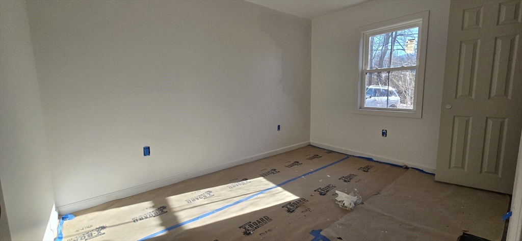 109 Mendon Road Sutton, MA 01590 - Photo 12 of 17 an empty room with windows