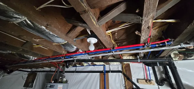 a view of walk in closet with clothes