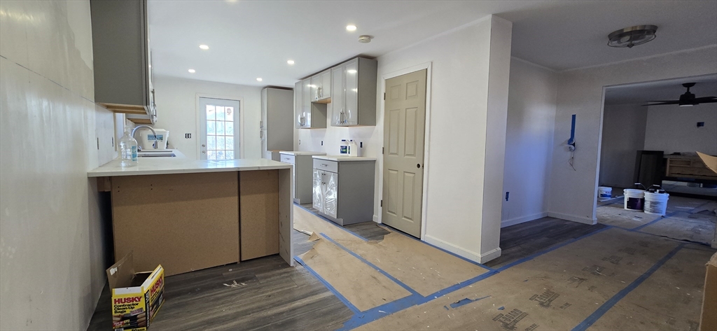 109 Mendon Road Sutton, MA 01590 - Photo 3 of 17 a kitchen with stainless steel appliances granite countertop a refrigerator and a sink