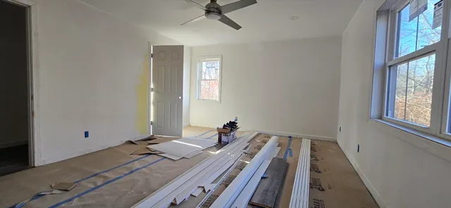 a bed room with a bed and a window