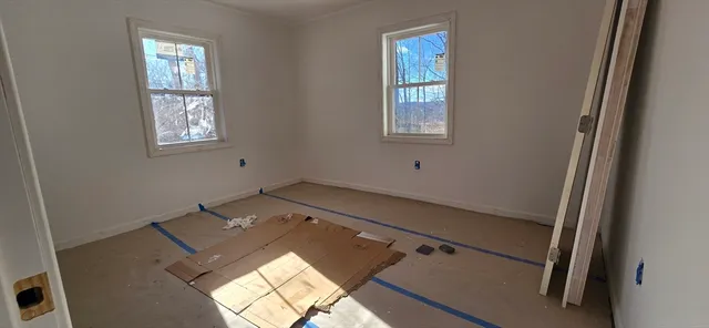 a view of an empty room and window
