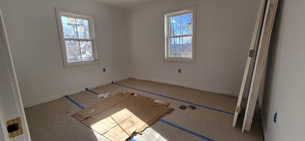 109 Mendon Road Sutton, MA 01590 - Photo 9 of 17 a view of an empty room and window