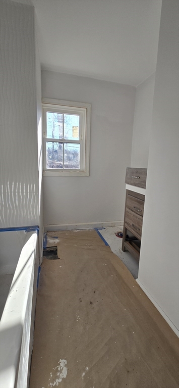 109 Mendon Road Sutton, MA 01590 - Photo 10 of 17 an empty room with wooden floor and windows