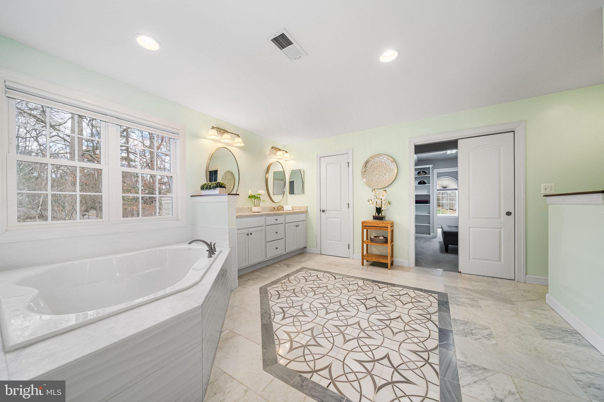 1232 Shenandoah Road Alexandria, VA 22308 - Photo 30 of 50 a bathroom with a tub sink and mirror