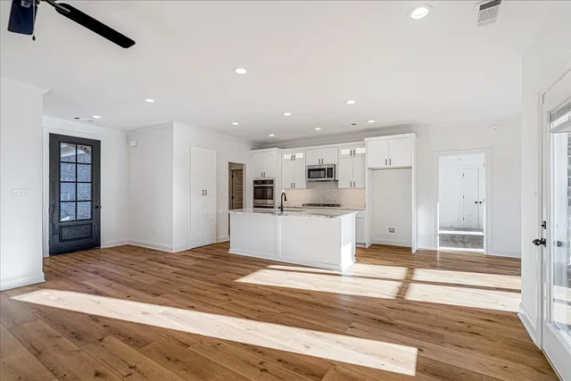 a view of a kitchen from the hallway