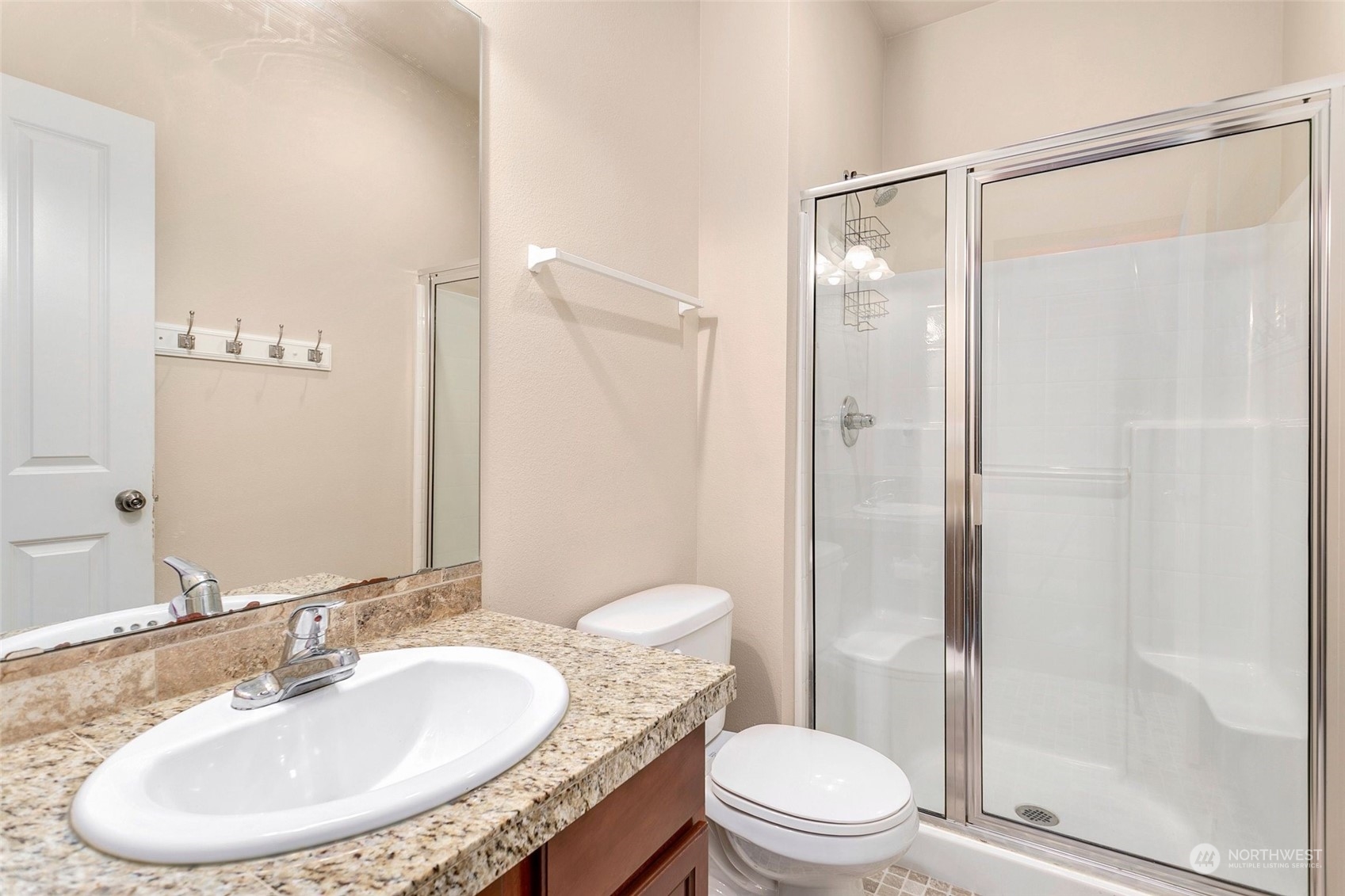 1137 215th Place Southeast Bothell, WA 98021 - Photo 15 of 30 a bathroom with a granite countertop sink toilet and shower