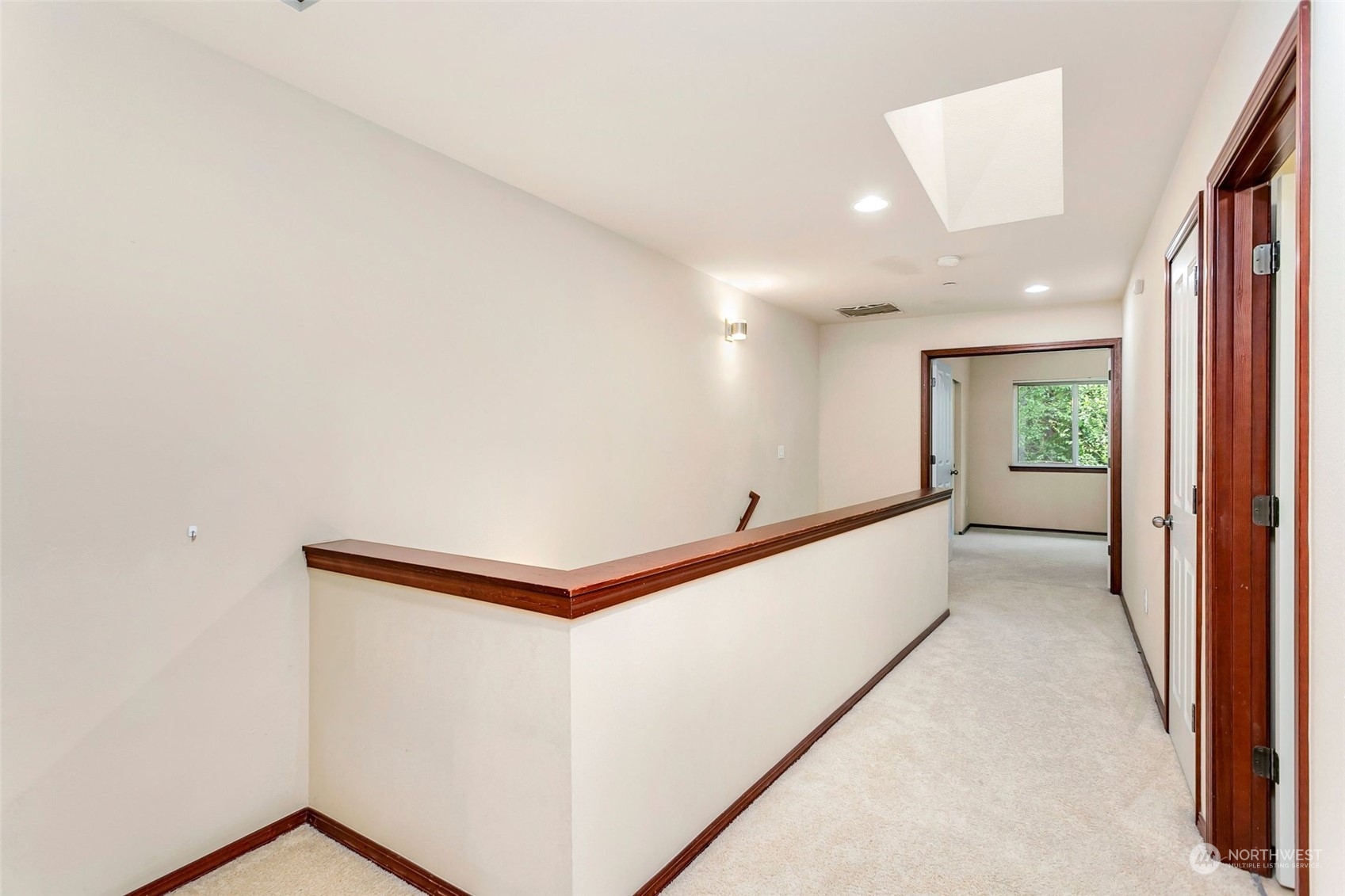 1137 215th Place Southeast Bothell, WA 98021 - Photo 16 of 30 a view of a hallway with natural light
