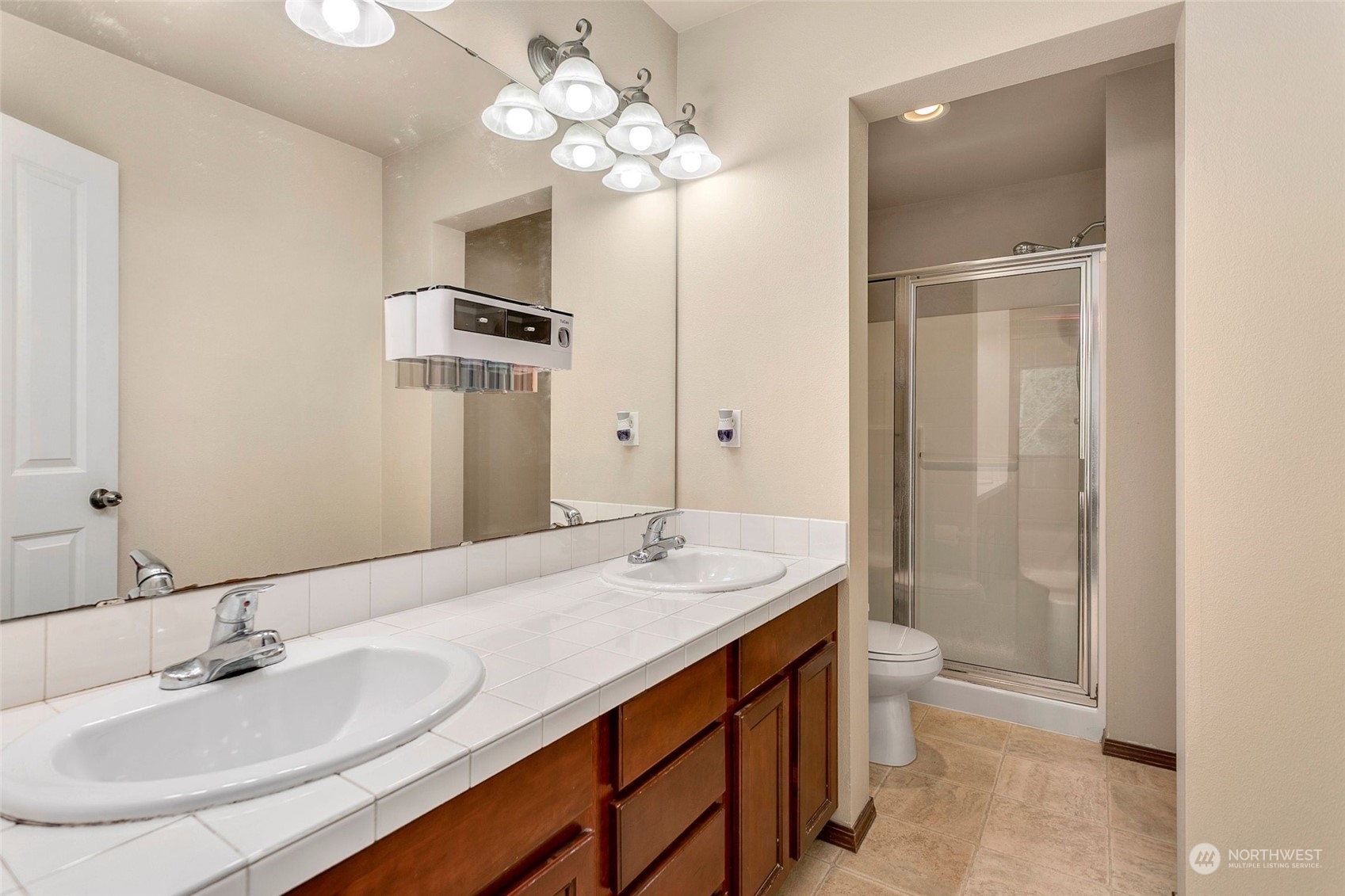 1137 215th Place Southeast Bothell, WA 98021 - Photo 20 of 30 a bathroom with a sink a light fixture and a mirror