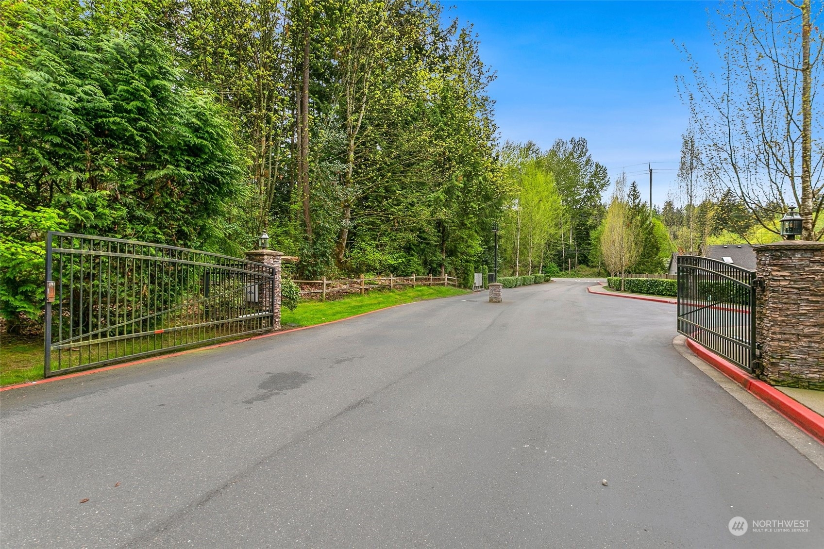 1137 215th Place Southeast Bothell, WA 98021 - Photo 27 of 30 a view of a road with iron fence