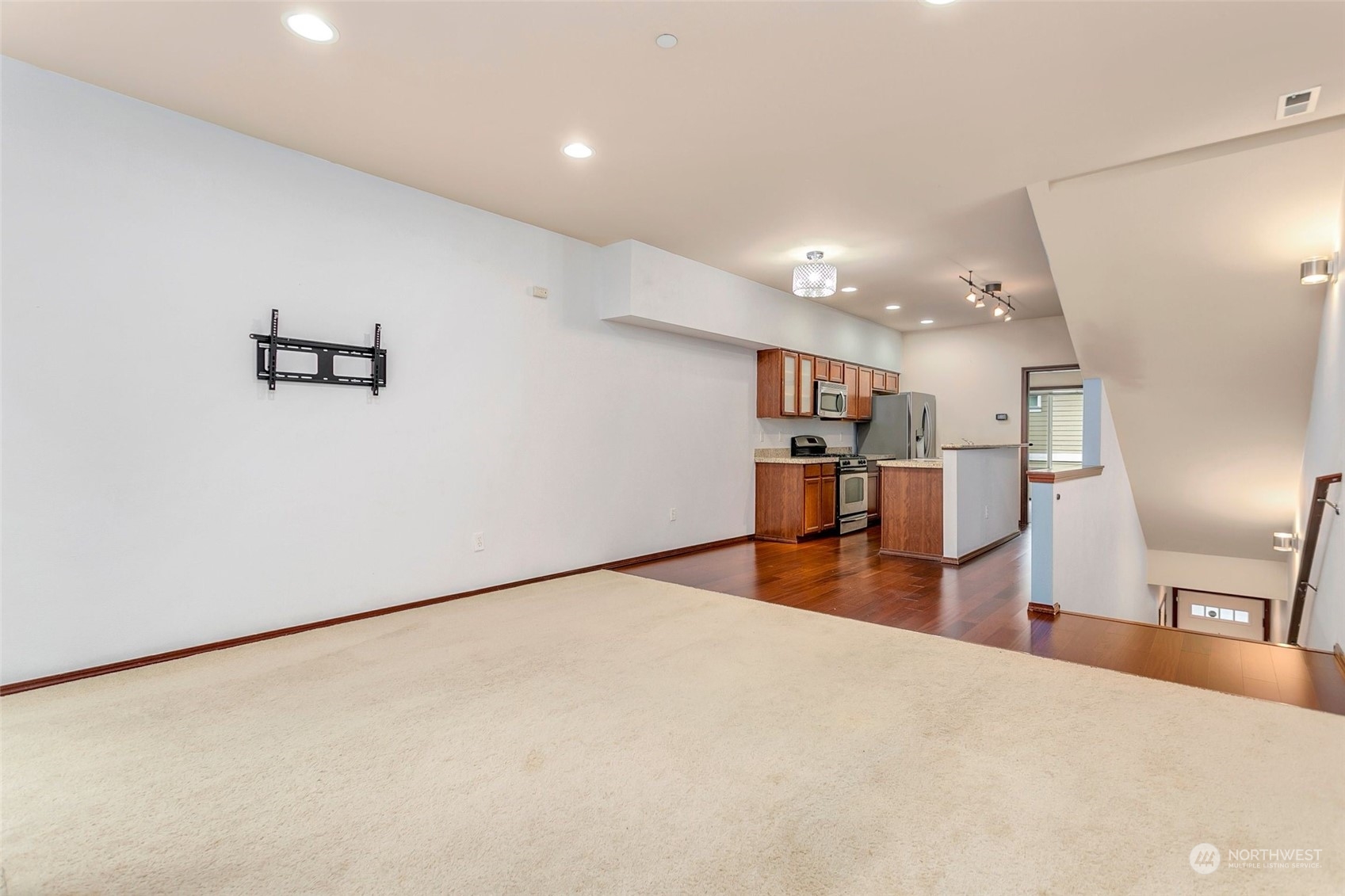 1137 215th Place Southeast Bothell, WA 98021 - Photo 3 of 30 a view of a livingroom with furniture and wooden floor