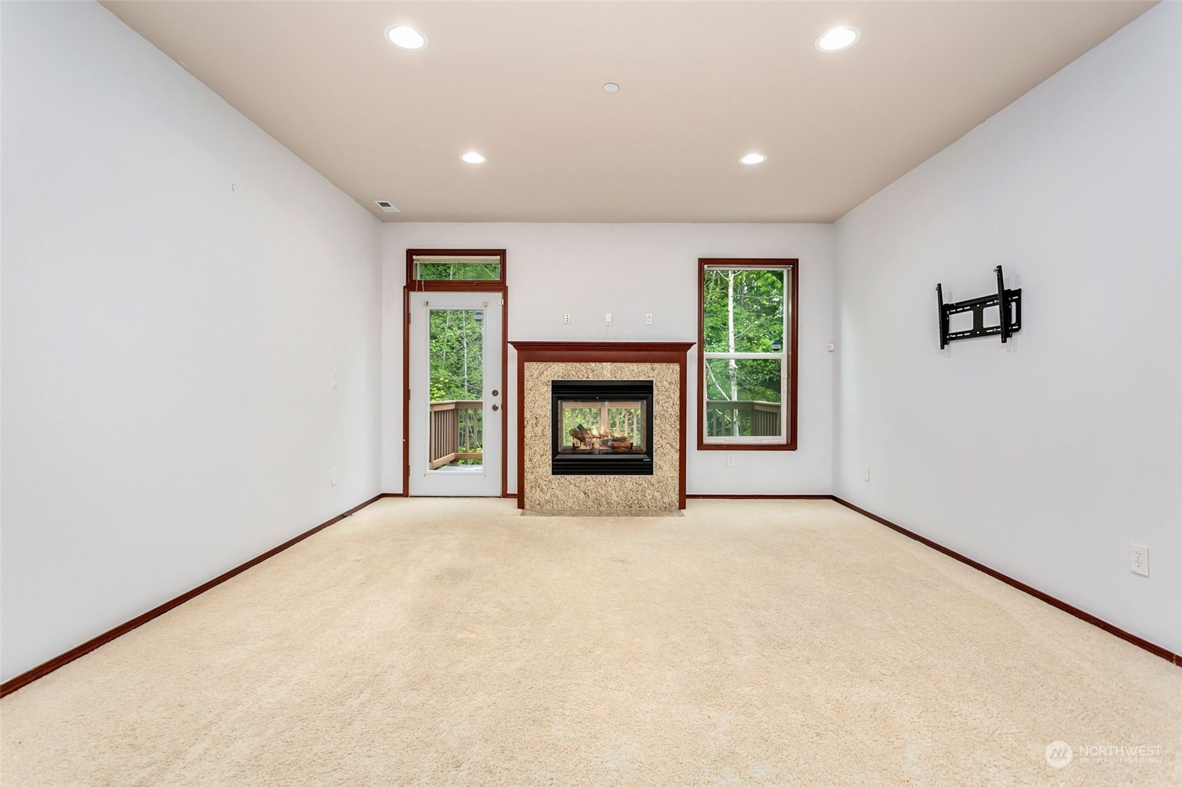 1137 215th Place Southeast Bothell, WA 98021 - Photo 5 of 30 an empty room with windows and fireplace