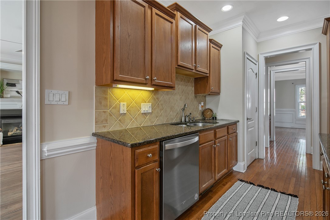 2721 Plum Ridge Road Fayetteville, NC 28306 - Photo 17 of 50 a kitchen with stainless steel appliances granite countertop a stove and a refrigerator