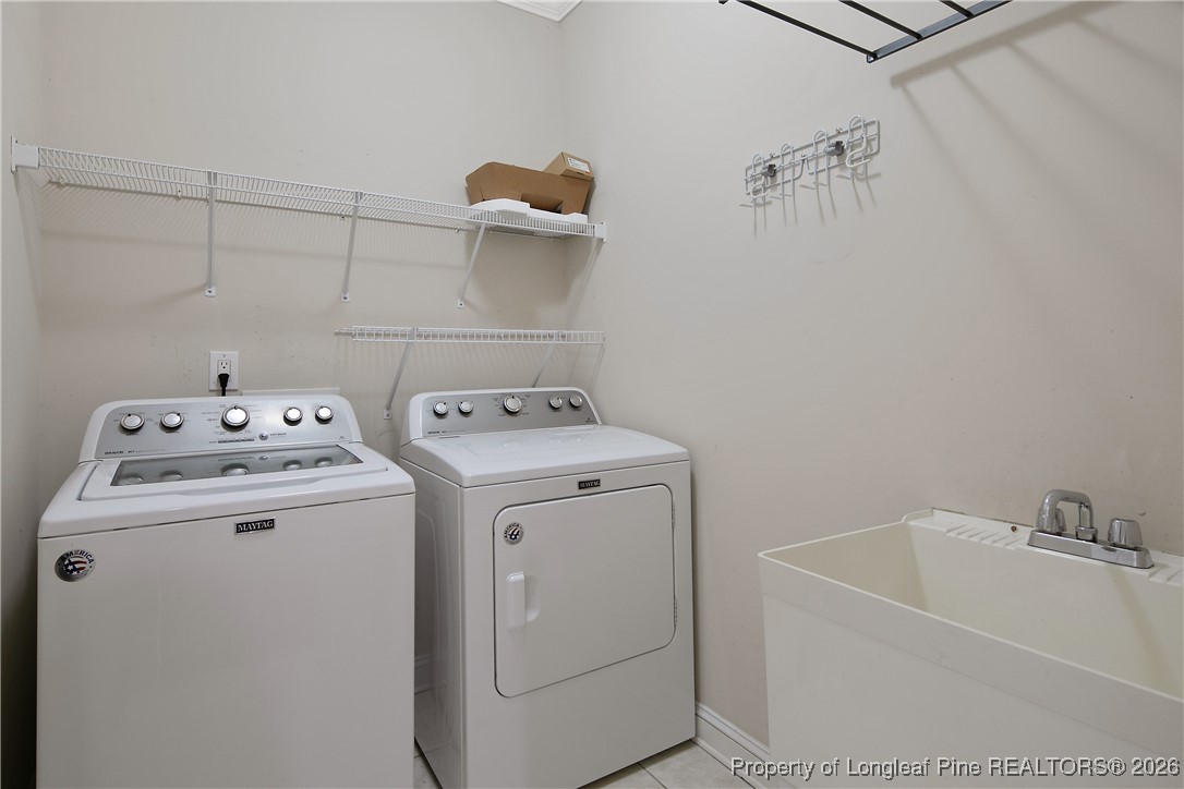 2721 Plum Ridge Road Fayetteville, NC 28306 - Photo 22 of 50 a utility room with dryer and washer