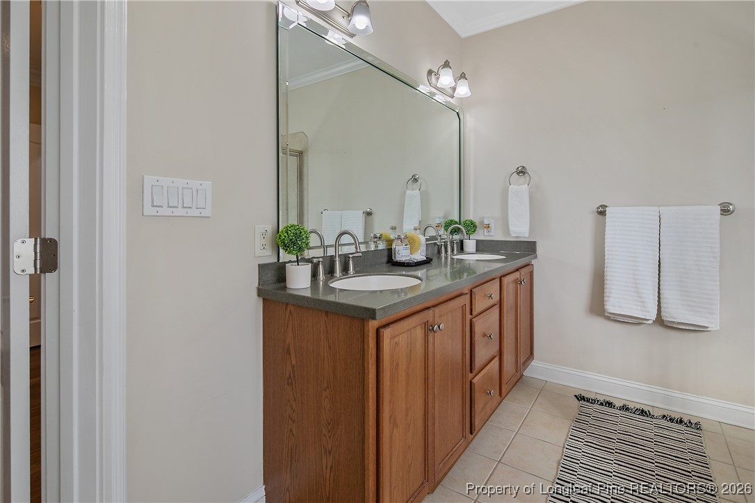 2721 Plum Ridge Road Fayetteville, NC 28306 - Photo 27 of 50 a bathroom with sinks a vanity and a mirror