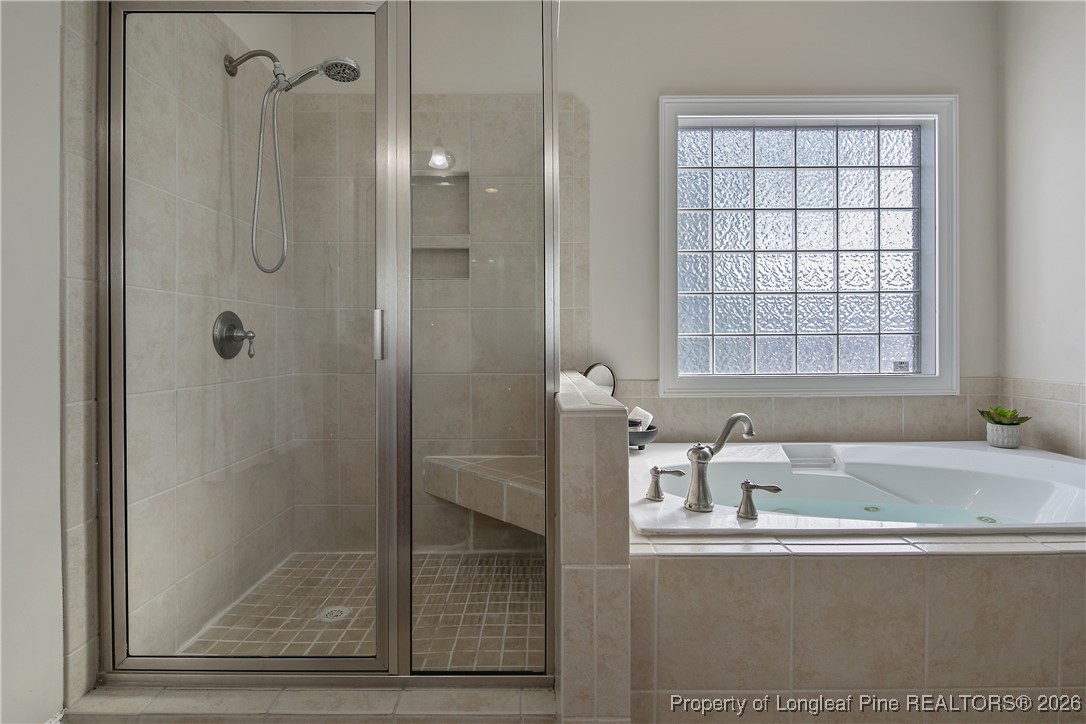 2721 Plum Ridge Road Fayetteville, NC 28306 - Photo 29 of 50 a bathroom with a tub shower and sink