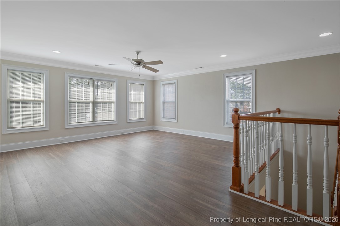 2721 Plum Ridge Road Fayetteville, NC 28306 - Photo 31 of 50 a view of an empty room with wooden floor and a window