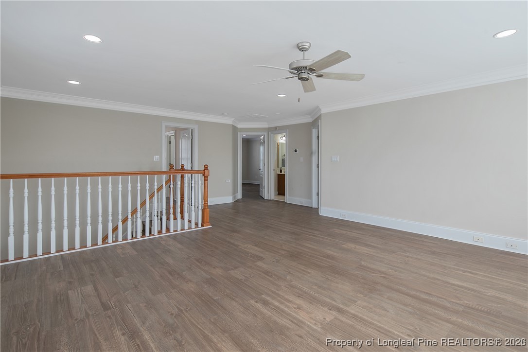 2721 Plum Ridge Road Fayetteville, NC 28306 - Photo 32 of 50 a view of an empty room with wooden floor