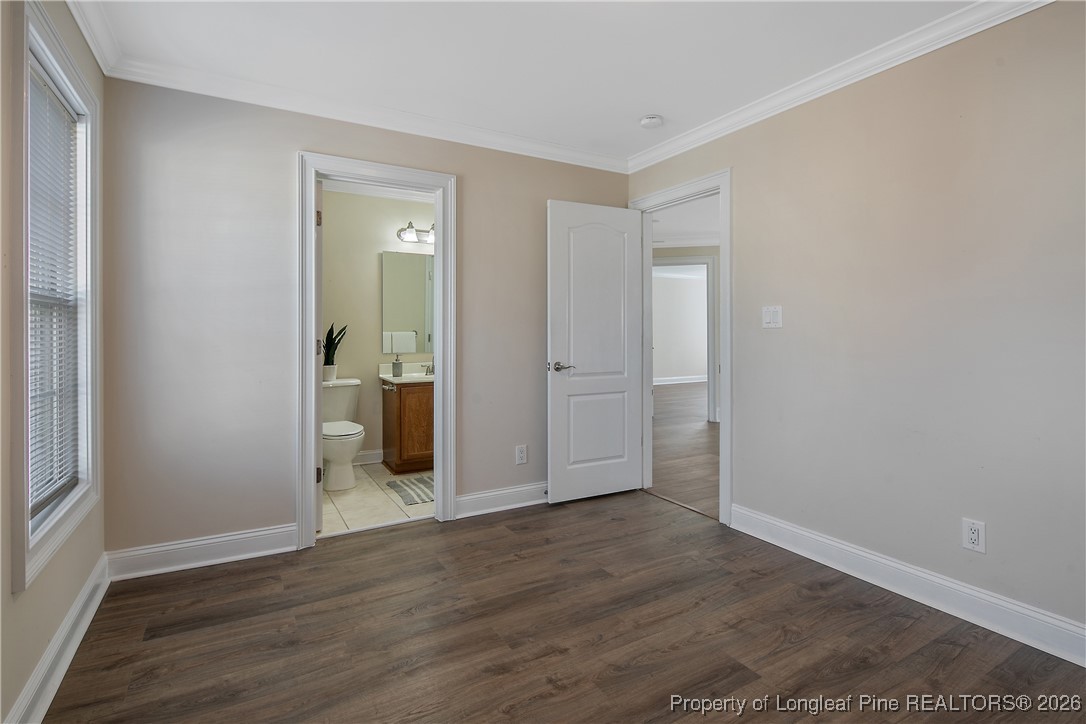 2721 Plum Ridge Road Fayetteville, NC 28306 - Photo 35 of 50 an empty room with wooden floor and entrance
