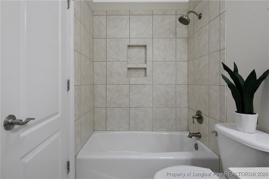 2721 Plum Ridge Road Fayetteville, NC 28306 - Photo 37 of 50 a bathroom with a bathtub toilet and shower