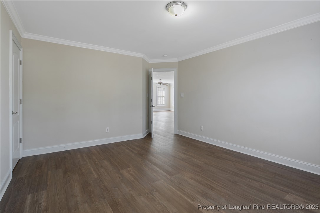 2721 Plum Ridge Road Fayetteville, NC 28306 - Photo 40 of 50 an empty room with wooden floor and windows