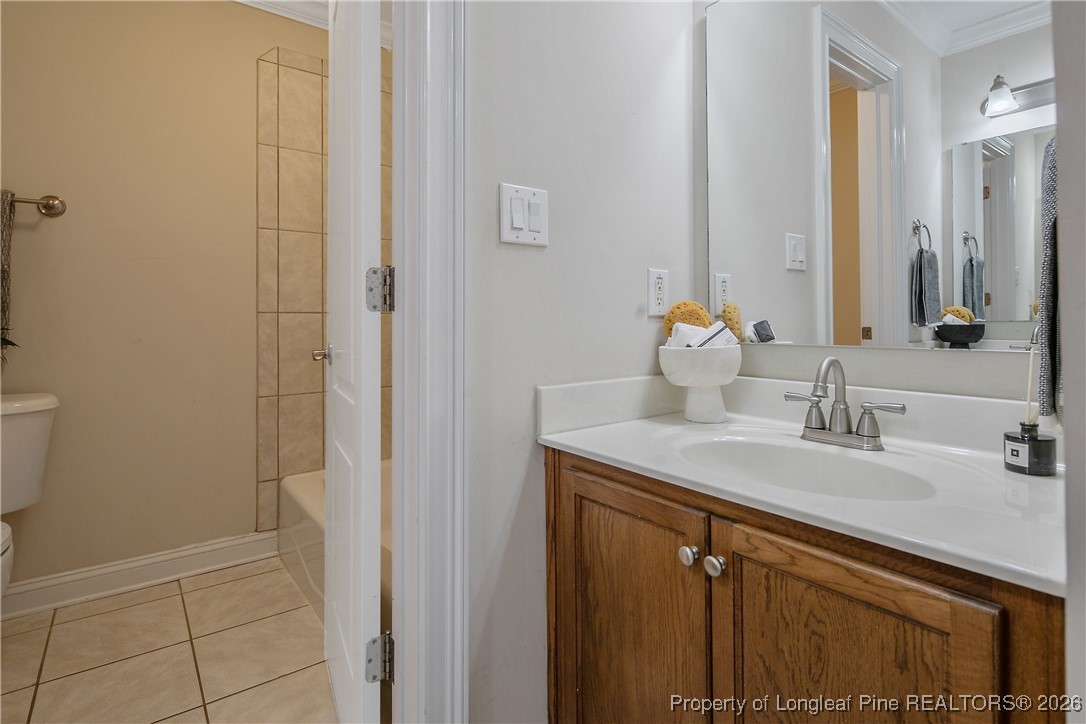 2721 Plum Ridge Road Fayetteville, NC 28306 - Photo 42 of 50 a bathroom with a sink and a mirror