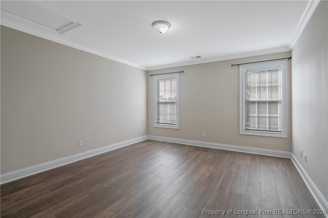 2721 Plum Ridge Road Fayetteville, NC 28306 - Photo 43 of 50 an empty room with wooden floor and windows