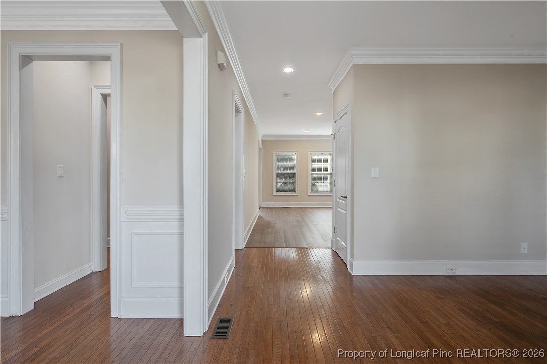 2721 Plum Ridge Road Fayetteville, NC 28306 - Photo 5 of 50 a view of a hallway with wooden floor