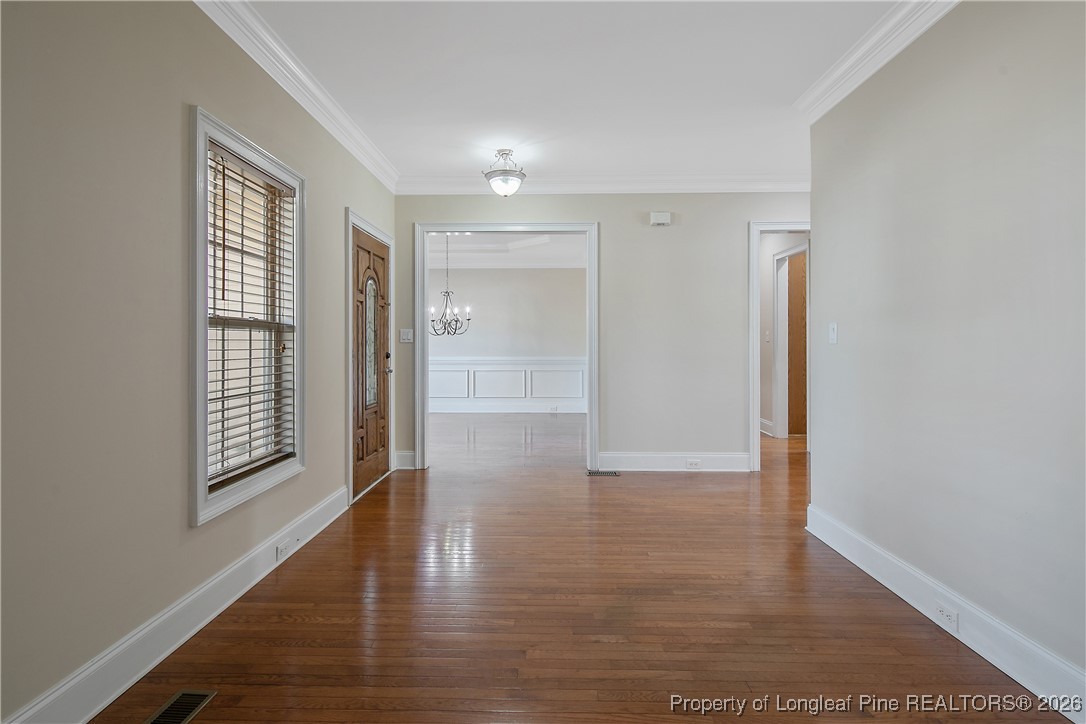 2721 Plum Ridge Road Fayetteville, NC 28306 - Photo 7 of 50 a view of entryway with wooden floor