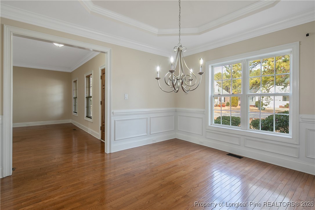 2721 Plum Ridge Road Fayetteville, NC 28306 - Photo 9 of 50 a view of an empty room with wooden floor and a window