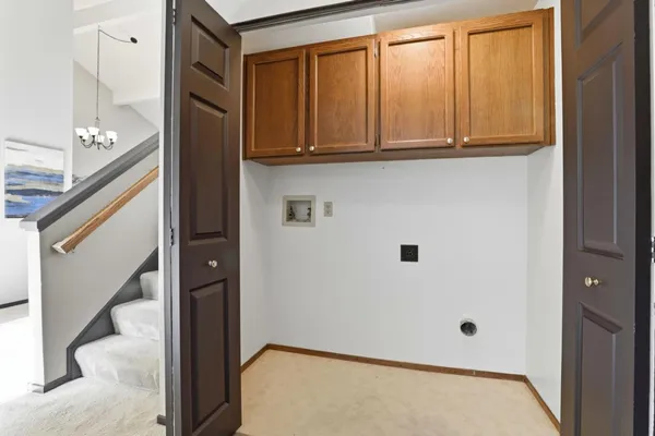 a spacious bedroom with a bed and a couch
