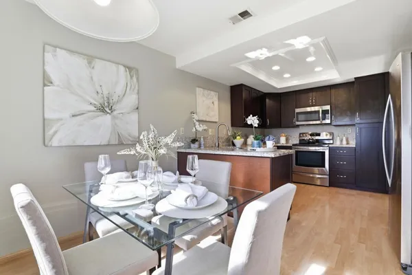 a dining room with furniture and window