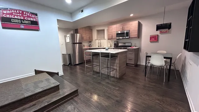 a kitchen with a sink appliances and cabinets