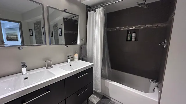 a bathroom with a bathtub and a sink