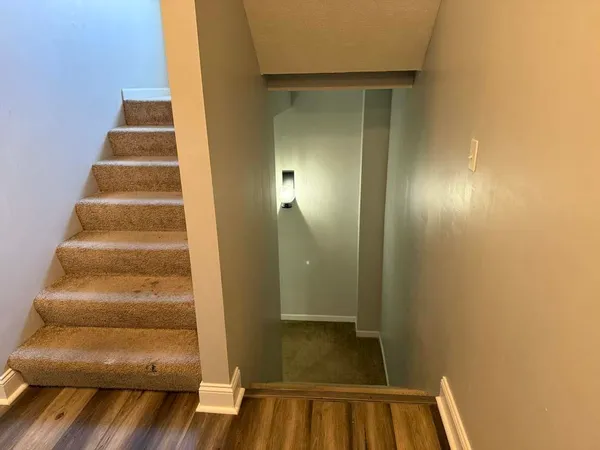 a view of staircase with white walls