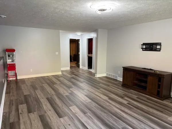 a view of a livingroom with wooden floor