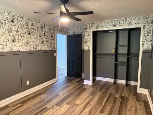 a kitchen with a sink and refrigerator