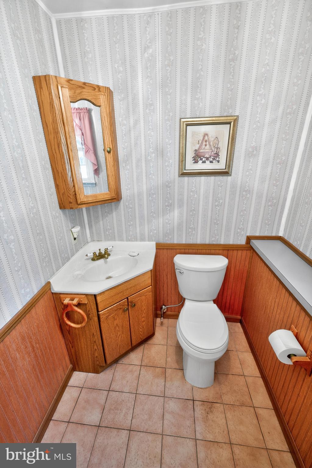 3701 Ebright Road Chadds Ford, PA 19317 - Photo 39 of 45 a bathroom with a toilet sink and mirror