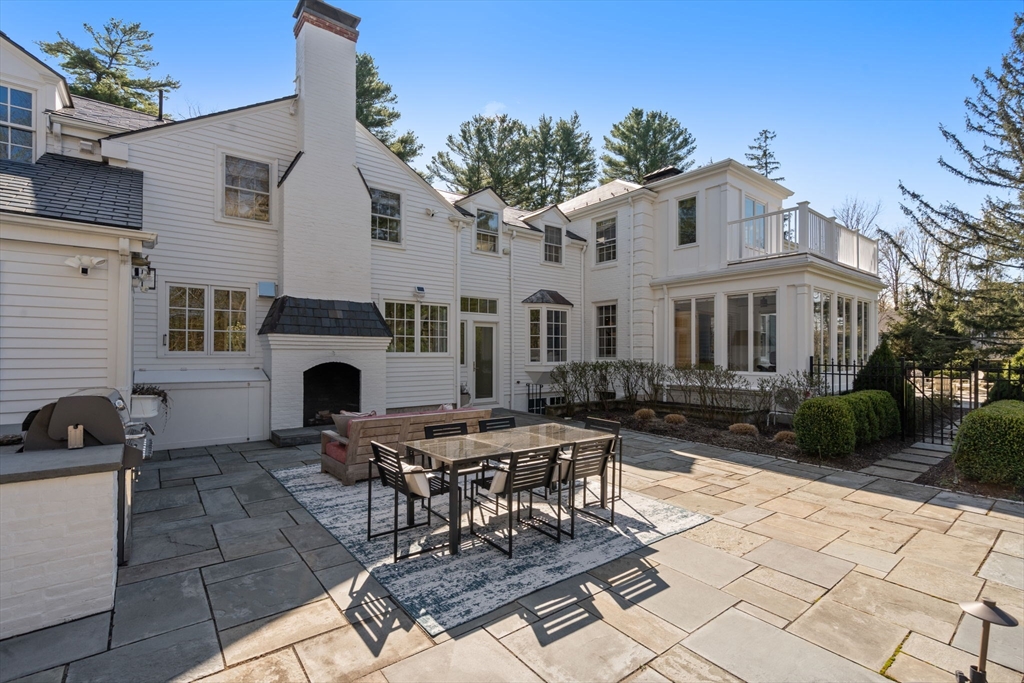389 Grove Street Needham, MA 02492 - Photo 35 of 40 a view of a patio with a table and chairs in a patio