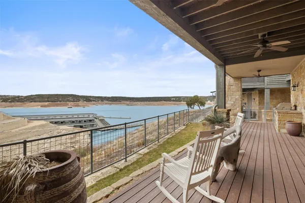 a view of a balcony with ocean view and ocean view