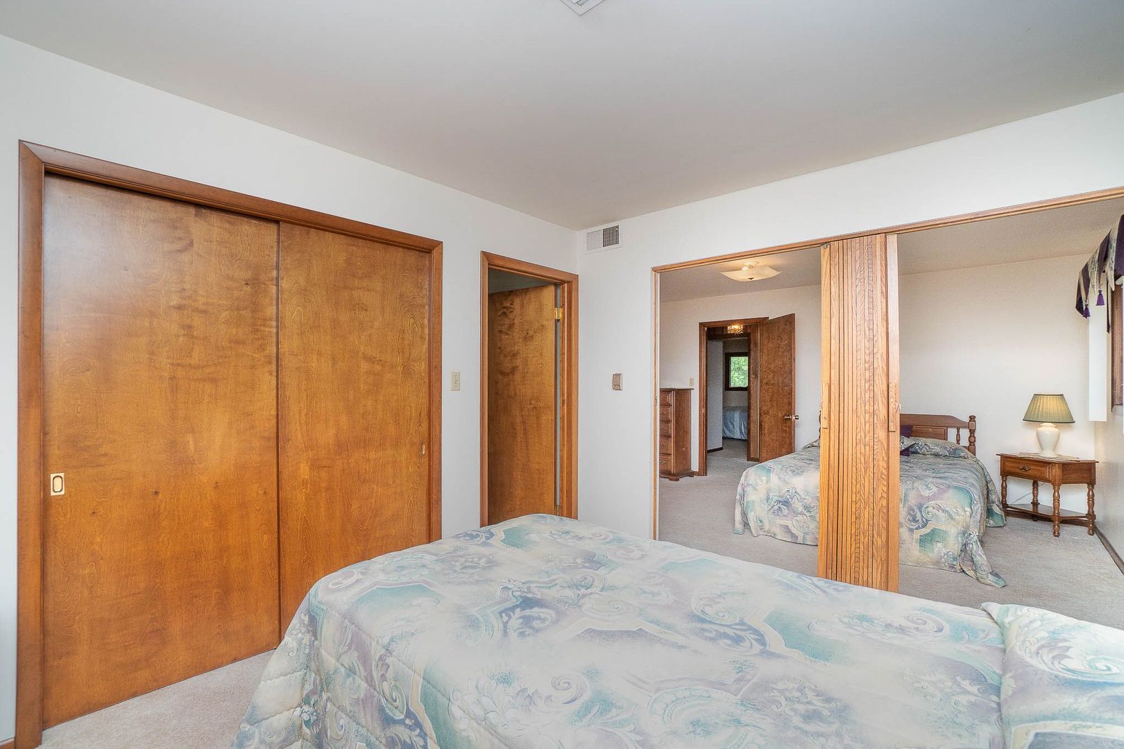 18561 Bock Road Lansing, IL 60438 - Photo 22 of 38 a bedroom with a bed and mirror