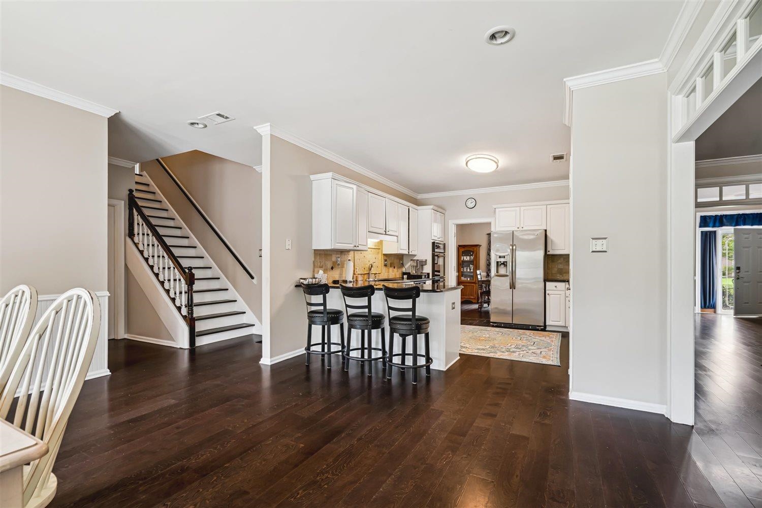 1489 John Ridge Drive Collierville, TN 38017 - Photo 15 of 39 a view of a dining room with furniture and wooden floor