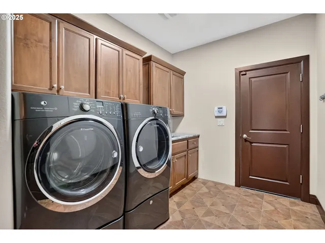 a kitchen with a refrigerator and washer