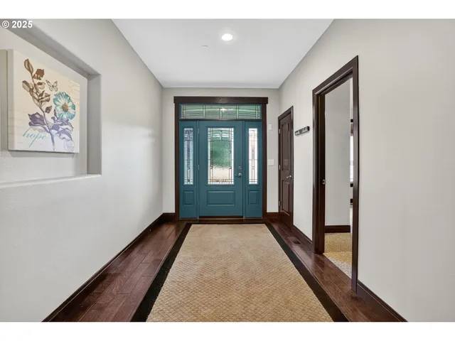 wooden floor in a hall with an entryway
