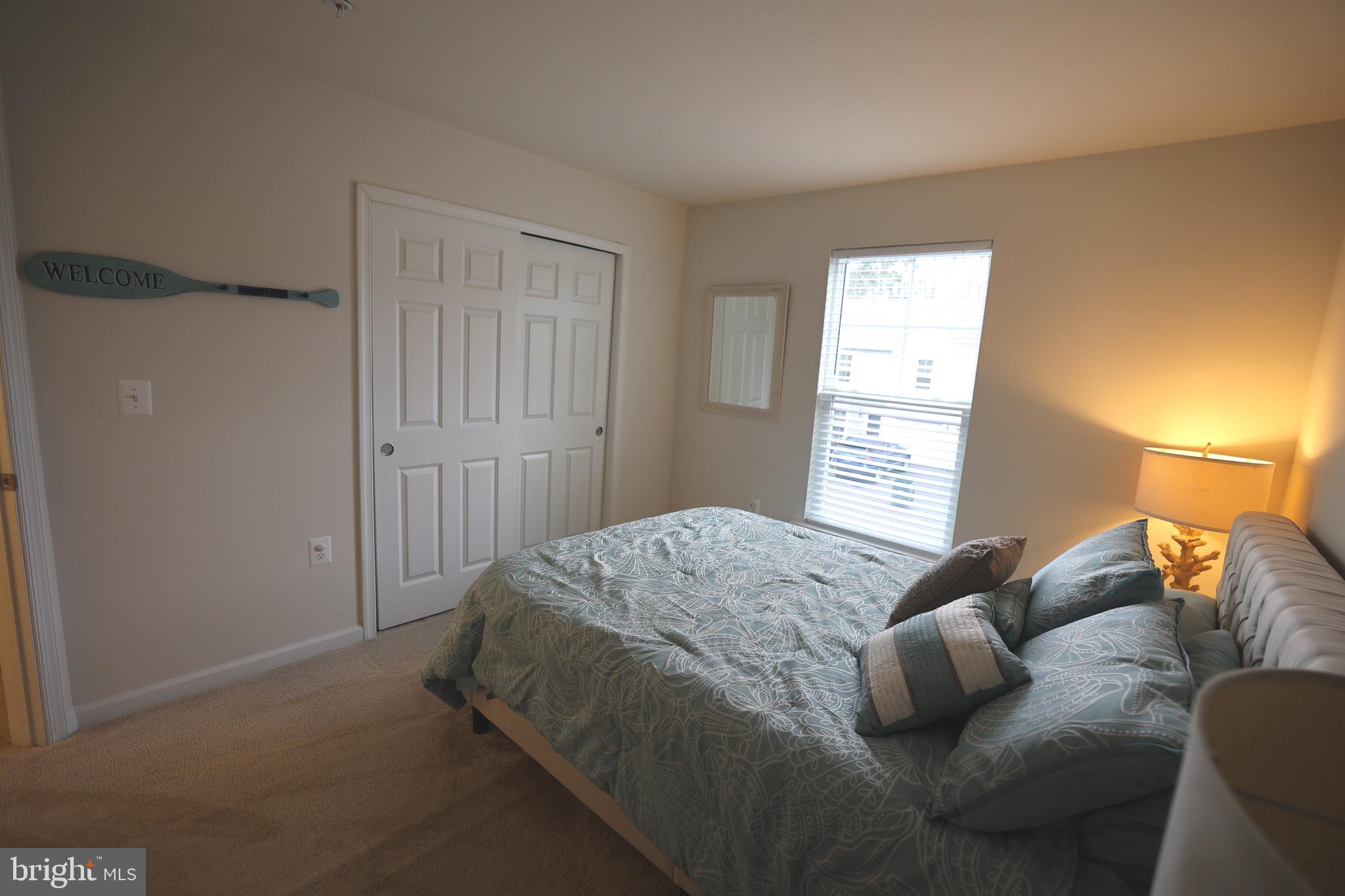 130 Intrepid Lane Berlin, MD 21811 - Photo 16 of 18 a spacious bedroom with a bed and window