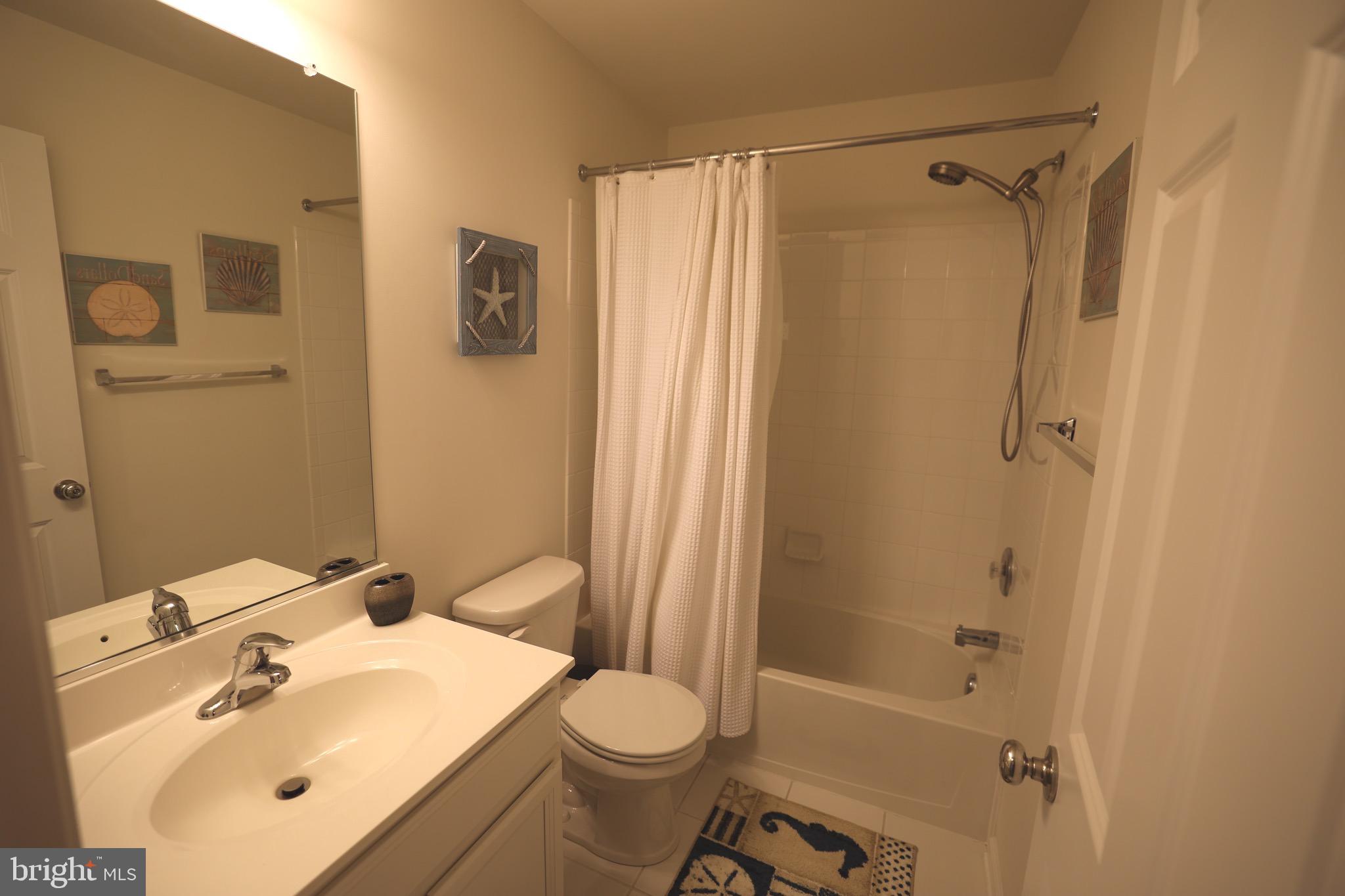 130 Intrepid Lane Berlin, MD 21811 - Photo 18 of 18 a bathroom with a sink toilet and shower