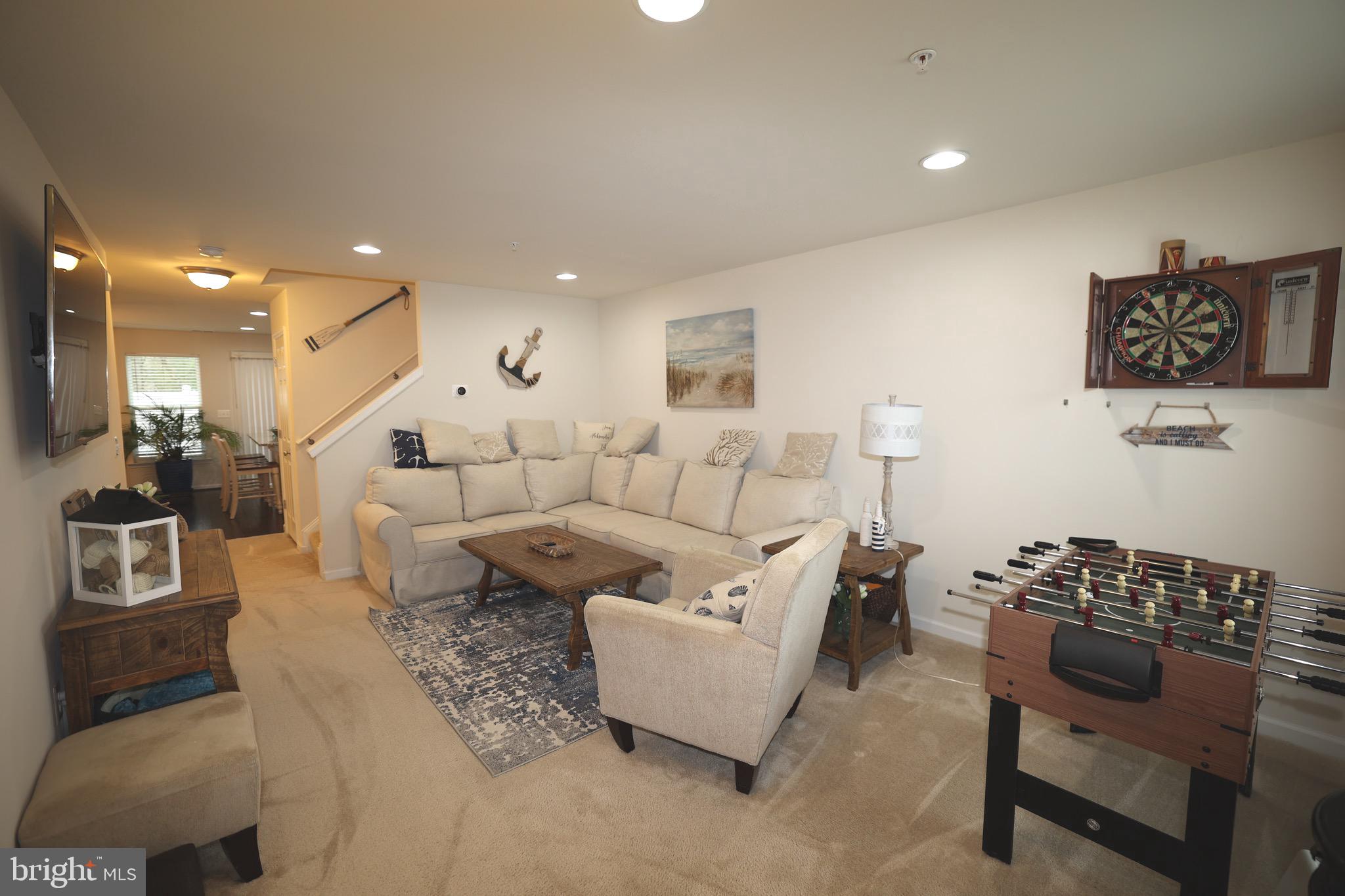 130 Intrepid Lane Berlin, MD 21811 - Photo 3 of 18 a living room with furniture and a table