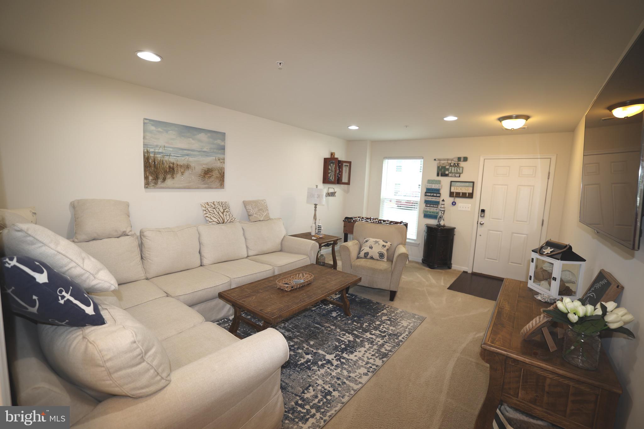 130 Intrepid Lane Berlin, MD 21811 - Photo 4 of 18 a living room with furniture and view of kitchen