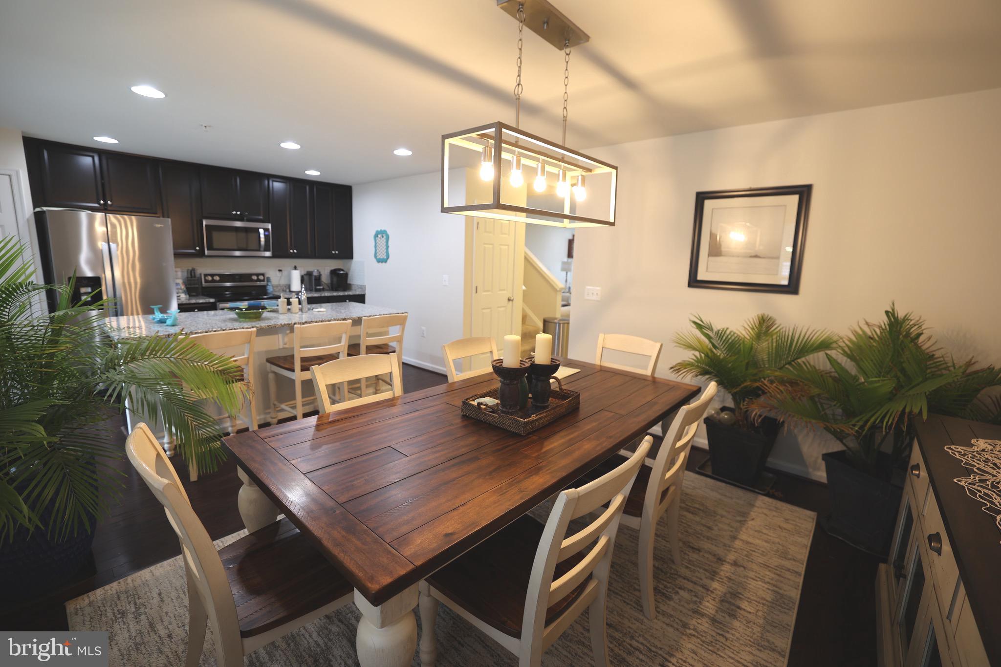 130 Intrepid Lane Berlin, MD 21811 - Photo 5 of 18 a view of a dining room with furniture and a kitchen